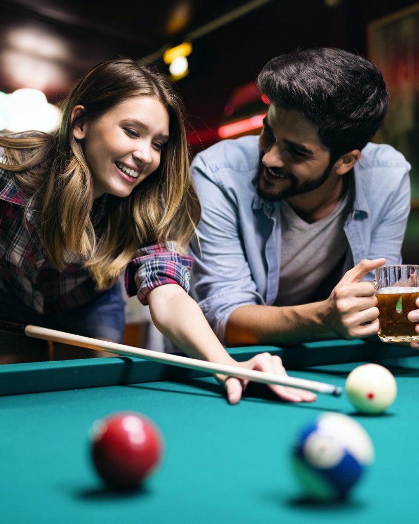 couple-dating-flirting-and-playing-billiard-in-a-pub.jpg